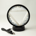 A circular black-framed LED lamp featuring a white pentagram design and light blue crystal stones around the inner ring, shown on a white background with its USB charging cable.